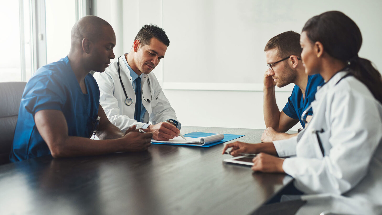 A physician reviewing a plan with an advisor